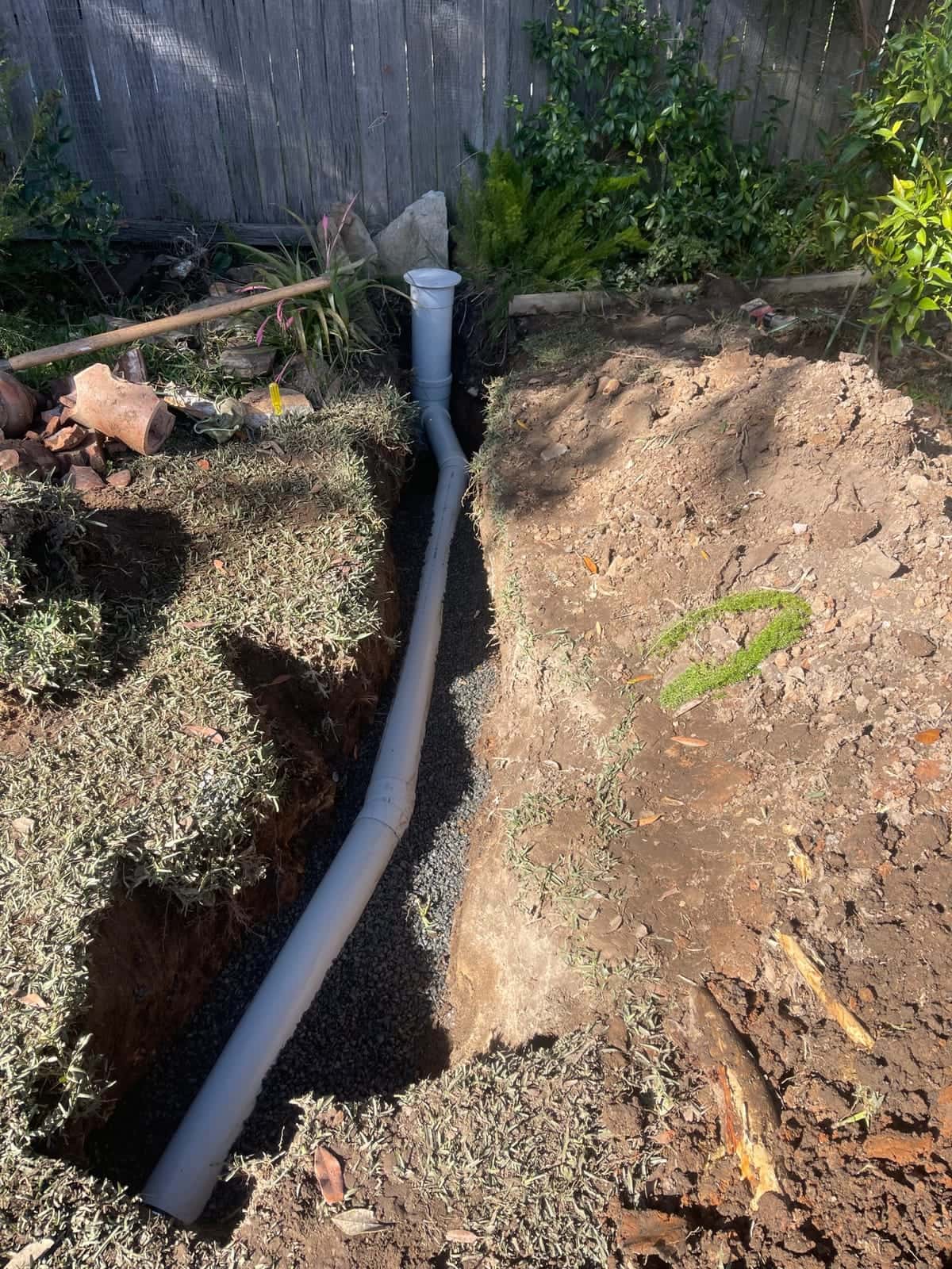 New drain pipe installed in a prepared trench