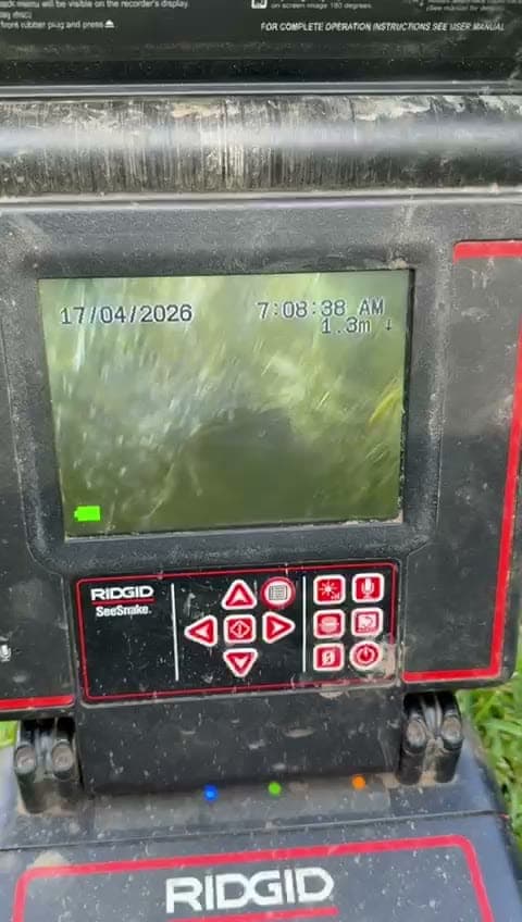 CCTV drain camera screen showing root intrusion inside a drain line