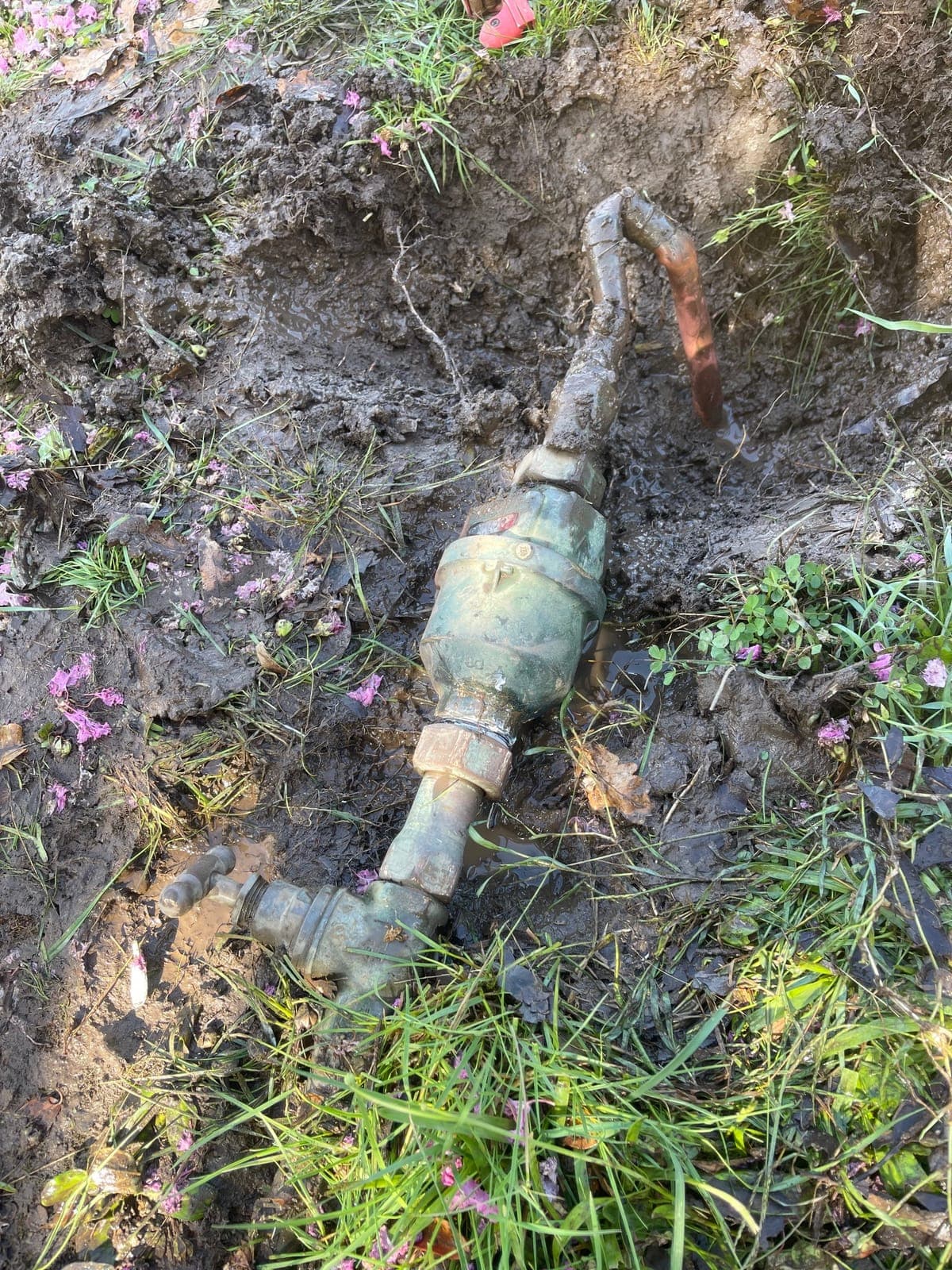 Drain access equipment set up beside an outdoor pipe