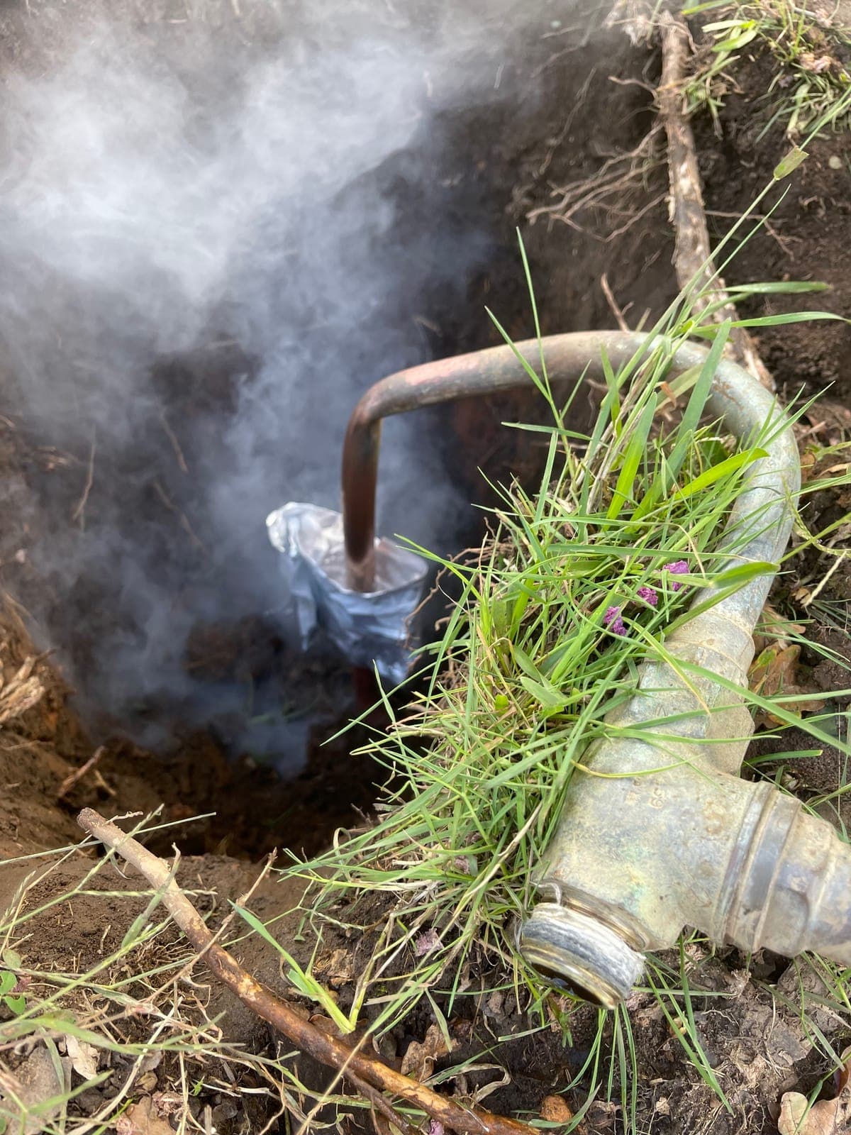 Drain equipment testing water flow at an outdoor access point