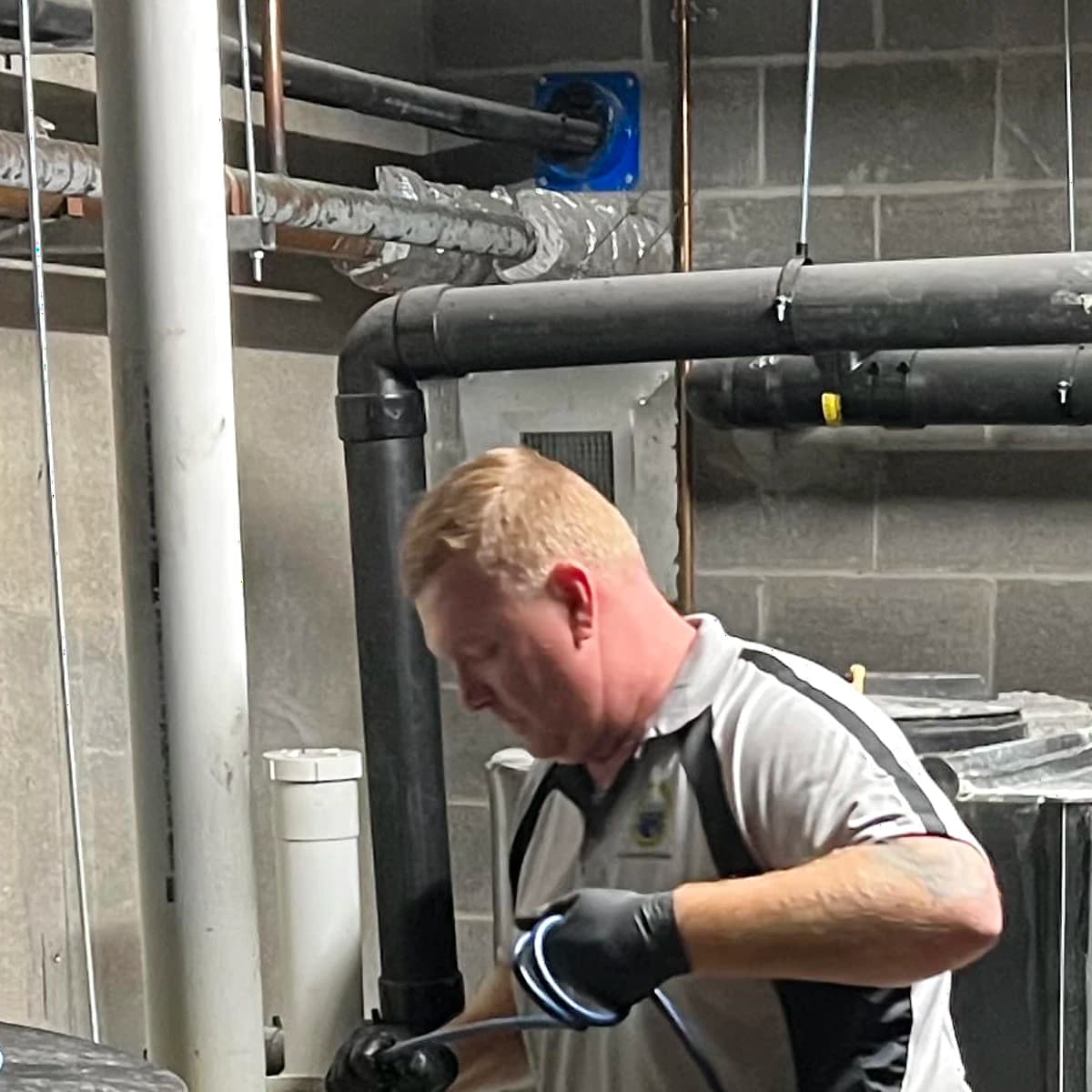 Scott Johnstone from Blocked Drains Sydney inspecting drain equipment